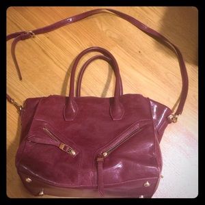 A cross body bag with removable strap